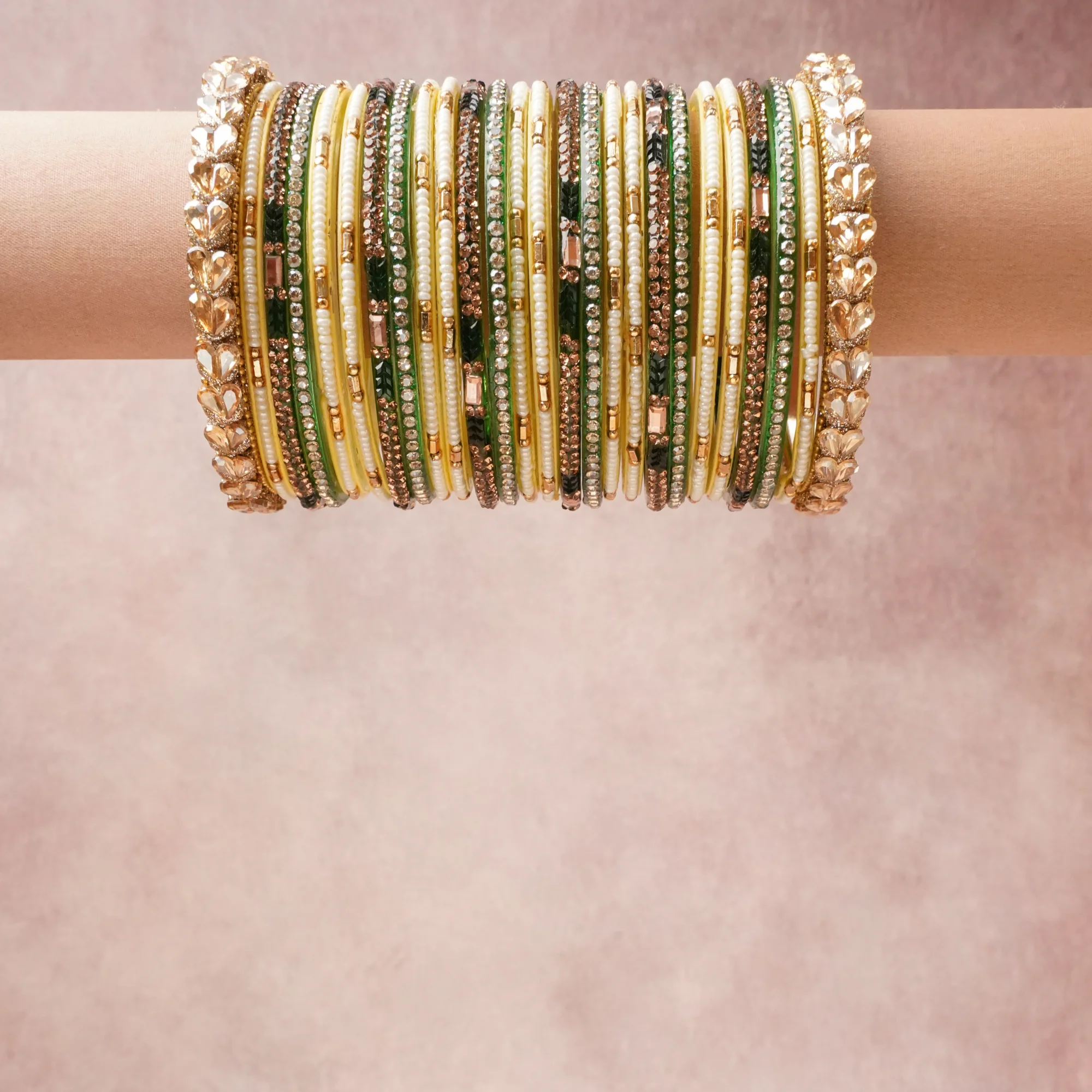 A grounding Green forms the heart of the set, while touches of Gold, Champagne, Ivory add charm.

A thoughtful composition of Metal Alloy, Lacquered Glass, Rhinestones, Faux Pearls, designed to feel complete without being heavy.
Each element layers seamlessly, creating a look that is refined, wearable and quietly striking.